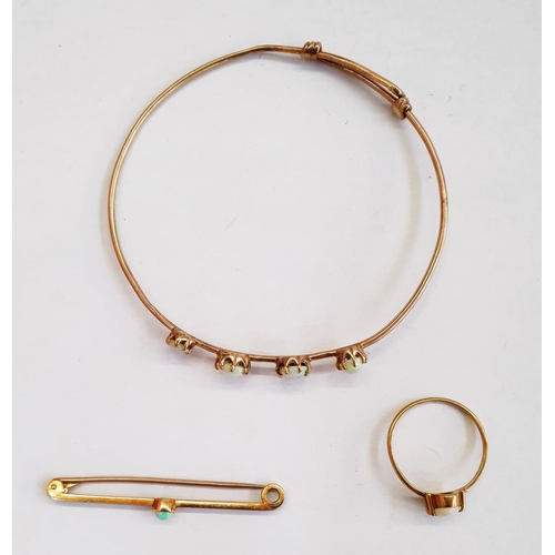 363 - Gold-coloured and four-stone opal bangle set graduated oval opals, an opal bar brooch and an opal ri... 