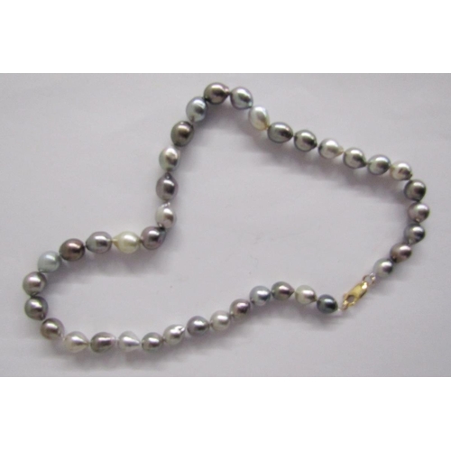 379 - Long string of pink cultured pearls, a shorter string of pink grained cream pearls, two strings of g... 