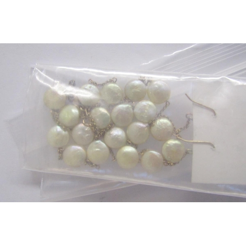 380 - Two long strings of pink, cream and other coloured cultured pearls, a string of coloured cultured pe... 