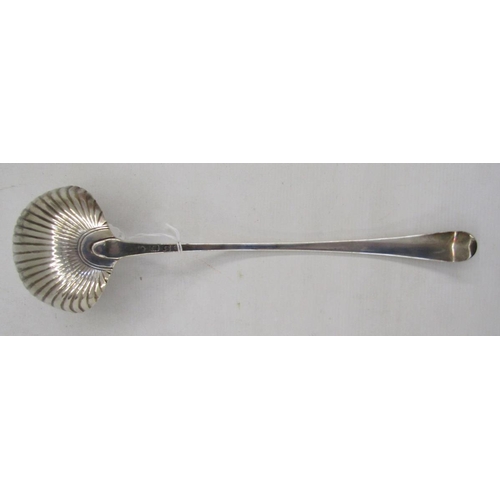 39 - Georgian silver sauce ladle, the bowl shaped as a scallopshell, bright cut handle, hallmarks rubbed,... 