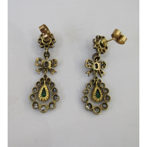 420B - Pair emerald and diamond drop earrings, each in the form of flowerhead diamond cluster above ribband... 