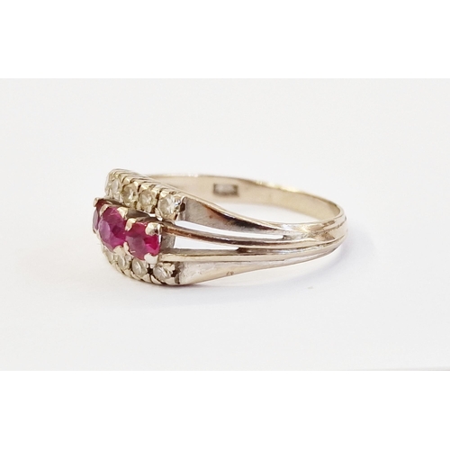 430D - 18ct white gold, ruby and diamond ring, set three graduated rubies flanked by two rows tiny diamonds... 