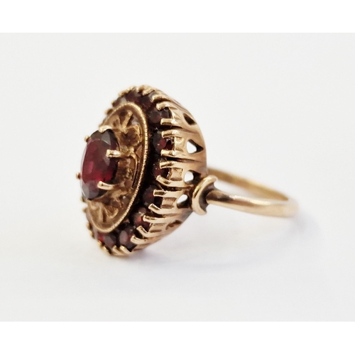 430E - 19th century 9ct gold and garnet ring, set centre oval facet-cut garnet in openwork setting and havi... 