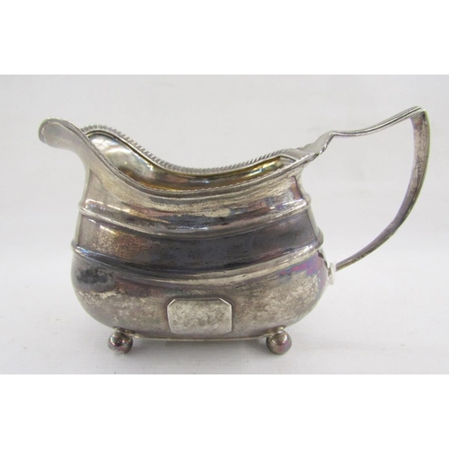 46 - George III silver pouring jug, with reeded border, raised on four bun feet, hallmarked London 1812, ... 