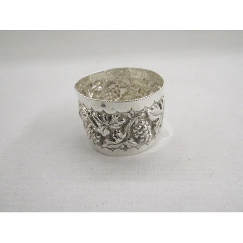 51 - Collection of eight silver napkin rings, of varying designs including pierced and engine turned, gro... 