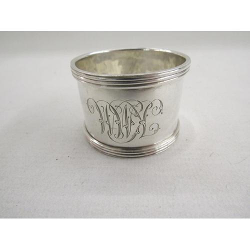 51 - Collection of eight silver napkin rings, of varying designs including pierced and engine turned, gro... 