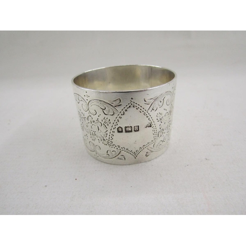 51 - Collection of eight silver napkin rings, of varying designs including pierced and engine turned, gro... 