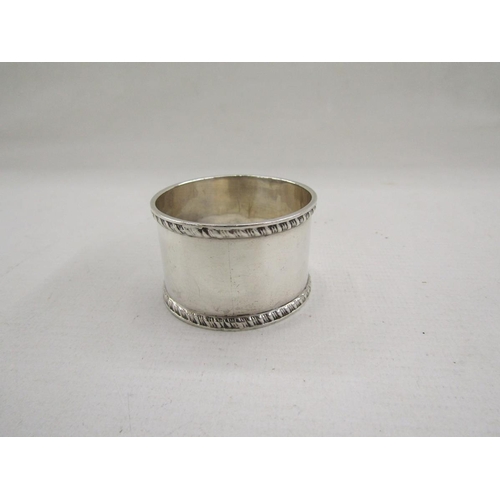 51 - Collection of eight silver napkin rings, of varying designs including pierced and engine turned, gro... 