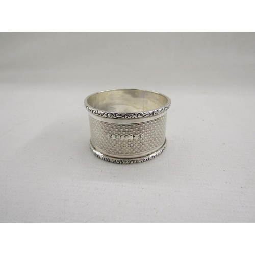 51 - Collection of eight silver napkin rings, of varying designs including pierced and engine turned, gro... 