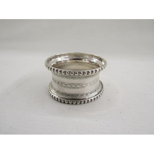 51 - Collection of eight silver napkin rings, of varying designs including pierced and engine turned, gro... 