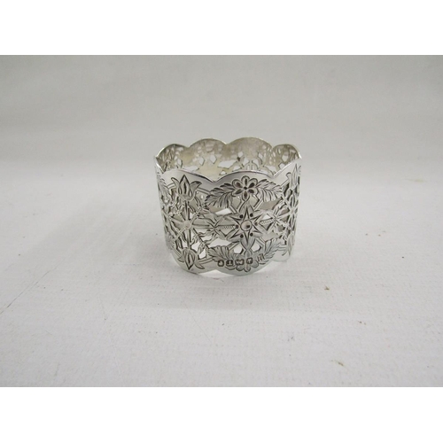 51 - Collection of eight silver napkin rings, of varying designs including pierced and engine turned, gro... 