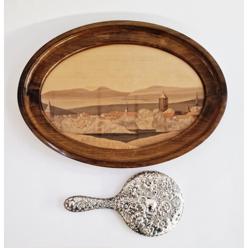 533 - Silver repousse hand mirror from a dressing table set, cast with a rocaille cartouche and flowers, h... 