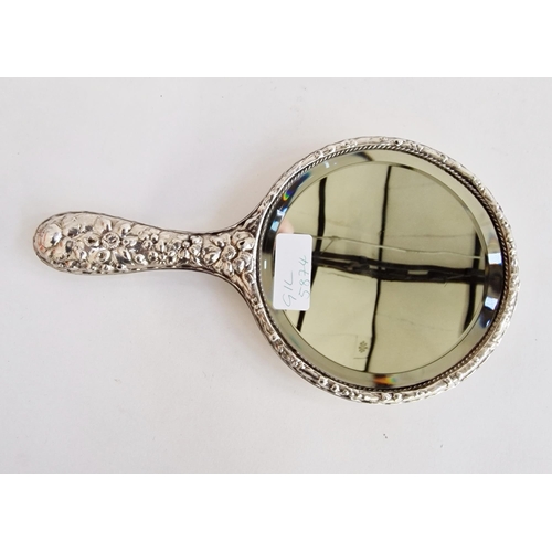 533 - Silver repousse hand mirror from a dressing table set, cast with a rocaille cartouche and flowers, h... 