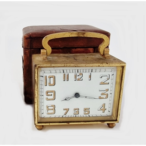 560 - Art Deco brass-mounted travelling clock in original brown leather case, of rectangular section, the ... 