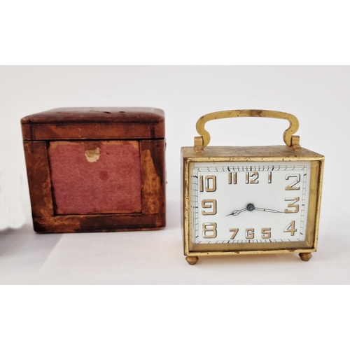 560 - Art Deco brass-mounted travelling clock in original brown leather case, of rectangular section, the ... 