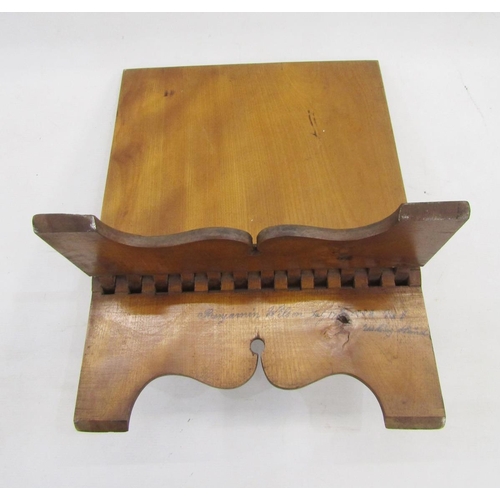 563 - Antique fruitwood book rest with inscription to reverse dated 1882, on scroll bracket feet, 38cm x 3... 