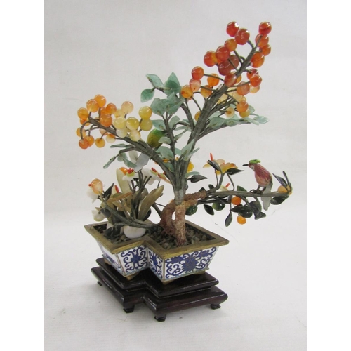 581 - Pair of Chinese enamel hardstone mounted trees, each mounted with a painted tall bird set with berri... 