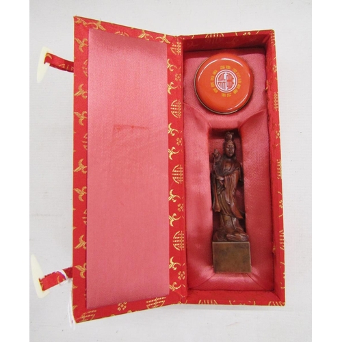 586 - Chinese boxed seal set, a boxed Japanese ink stick/block and a carved green stone figure of a Buddha... 