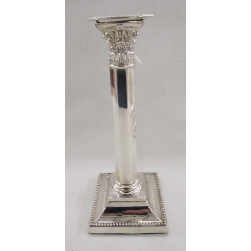 61 - Set of four early 20th century Georgian style silver candlesticks, of Corinthian column form, raised... 