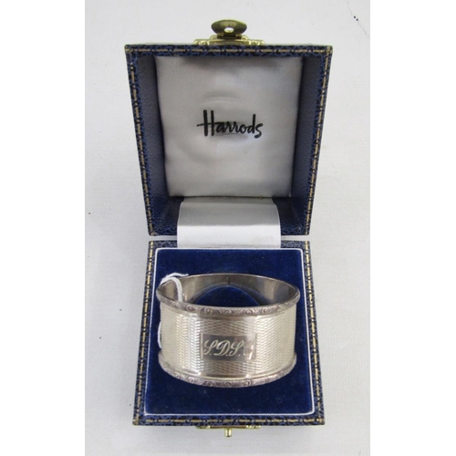 7 - 20th century silver napkin ring, oval form with engine turned decoration, hallmarked Birmingham 1973... 