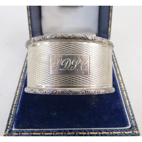 7 - 20th century silver napkin ring, oval form with engine turned decoration, hallmarked Birmingham 1973... 