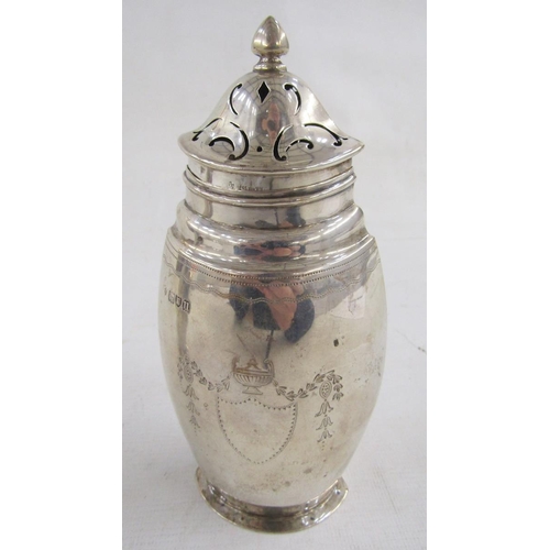 95 - George V silver sugar caster and matching cream jug, each flattened oval, engraved with shield, husk... 