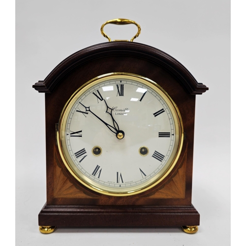 1007 - 20th century Comitti (London) mahogany-cased mantel clock of arched rectangular form, the white dial... 