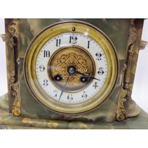 1008 - Late 19th century French onyx and gilt metal mounted mantel clock, of arched rectangular form, the i... 