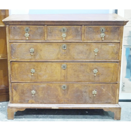 1050 - Early 18th century walnut chest of three short drawers and four long drawers, inlaid border, brass a... 