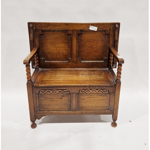 1122 - Oak monk's bench with carved frieze to the front panel, on turned feet, 72cm high x 92cm wide x 49cm... 