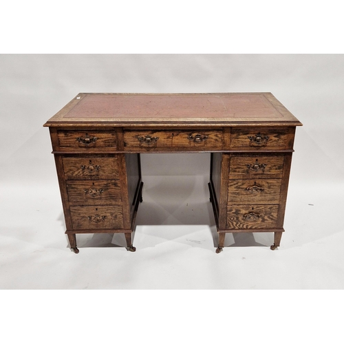 1142 - Early 20th century oak twin-pedestal desk with gilt tooled leather insert to top, central long drawe... 