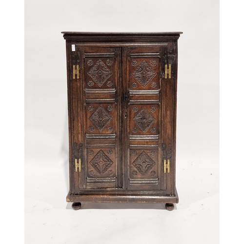 1143 - Antique oak side cabinet having two shelves enclosed by pair framed panel doors, all with lozenge ca... 