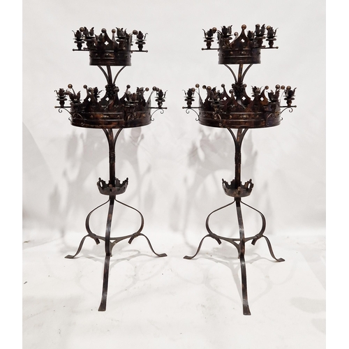1143A - Pair of Victorian-style gothic wrought iron floor standing candelabra, each formed of two tiers with... 