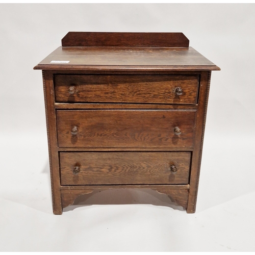 1151 - Early to mid 20th century oak chest of three long drawers, each with turned handles