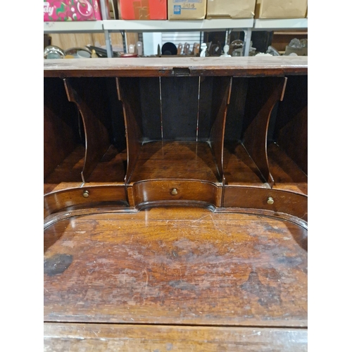 1162 - Georgian mahogany bureau, the fall front opening to reveal a blue gilt leather inset top and an asso... 