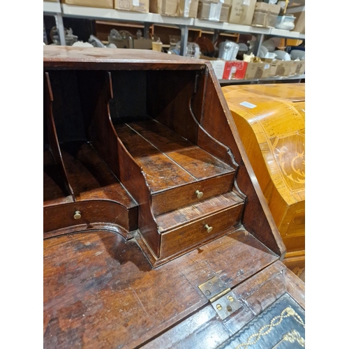 1162 - Georgian mahogany bureau, the fall front opening to reveal a blue gilt leather inset top and an asso... 