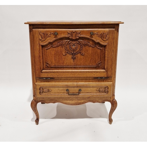 1165 - Contemporary oak storage cupboard, the fall front opening to reveal a storage compartment with mirro... 