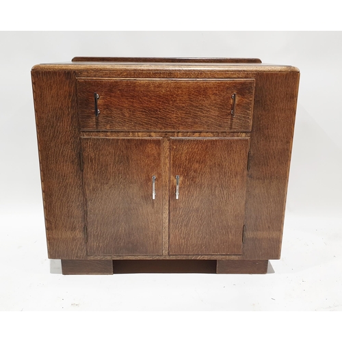 1168 - Mid century oak side cabinet with a single long drawer over two single door cupboards with chrome ha... 