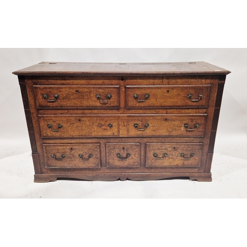 1169 - George III oak mule chest, the hinged panel top over three dummy and three real drawers, raised on b... 