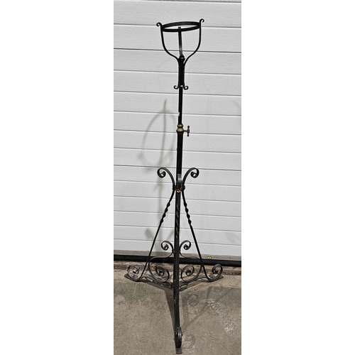 1172 - Antique iron telescopic standard lamp stand on curved tripod base, 121cm high at its shortest