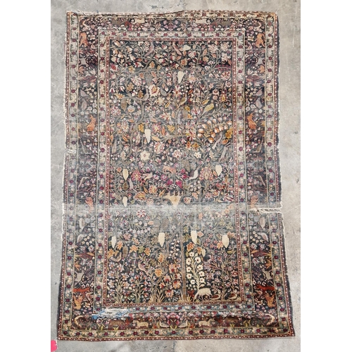 1282 - Silk Teheran rug, the shaded grey-green field with garden design of stylised multi-coloured large fl... 