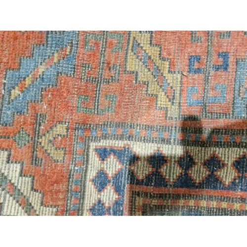 1283 - Caucasian rug with central hooked lozenge on green ground flanked by hooked squares with floral moti... 