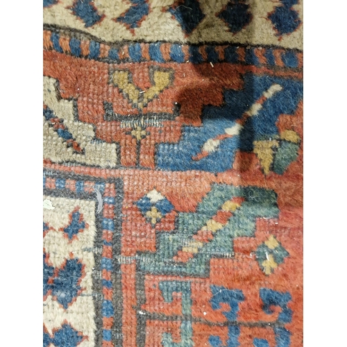 1283 - Caucasian rug with central hooked lozenge on green ground flanked by hooked squares with floral moti... 