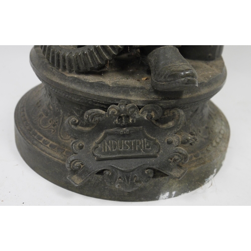 133 - French bronzed spelter figure of 'Industrie' cast as an aproned man beside an anvil, with cogs or wh... 