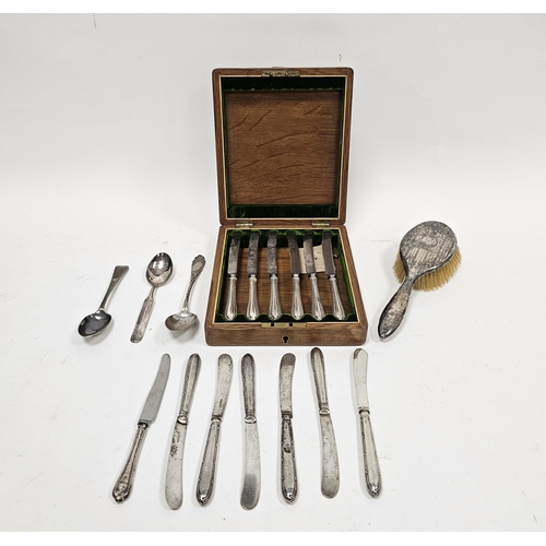 303 - Cased set of six silver handled butter knives, the blades marked Cooper Brothers, Sheffield, housed ... 