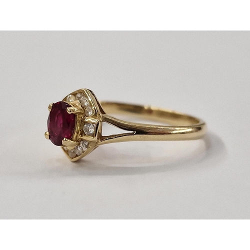 327 - 14ct gold ruby and white stone ring, set oval ruby surrounded by small diamonds in elliptical settin... 