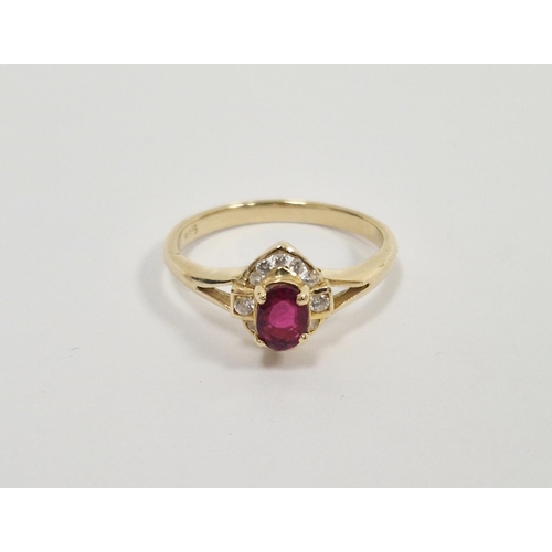 327 - 14ct gold ruby and white stone ring, set oval ruby surrounded by small diamonds in elliptical settin... 