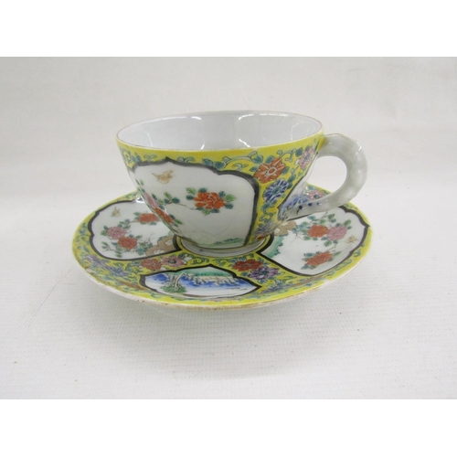 77 - 20th century Chinese porcelain breakfast cup and saucer decorated with fan-shaped panels of landscap... 