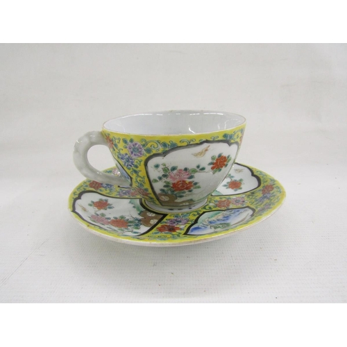 77 - 20th century Chinese porcelain breakfast cup and saucer decorated with fan-shaped panels of landscap... 