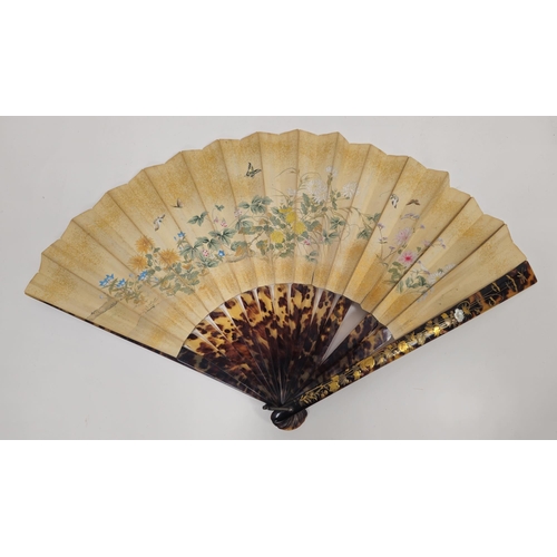 80 - Japanese tortoiseshell painted paper fan, the guards inlaid with gilt metal and mother-of-pearl, cor... 